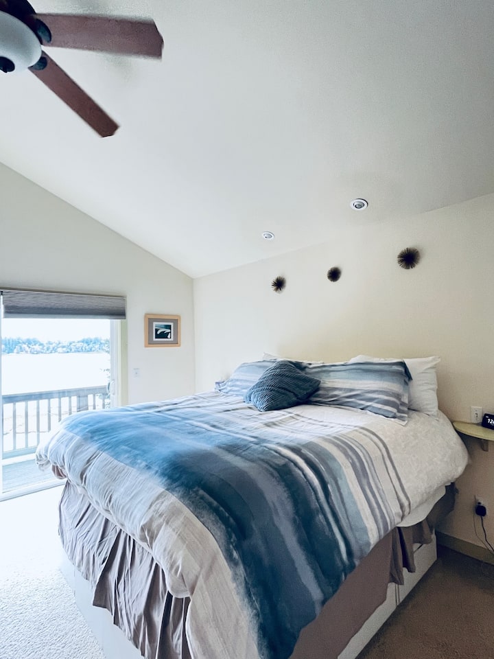 Main Bedroom.  Upstairs with private 3/4 bathroom.  Great Views of Puget Sound and Mount Rainier from attached deck. 