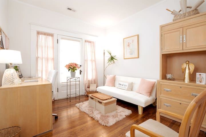 Office and sitting room with desk and comfortable seating perfect for working or relaxing.