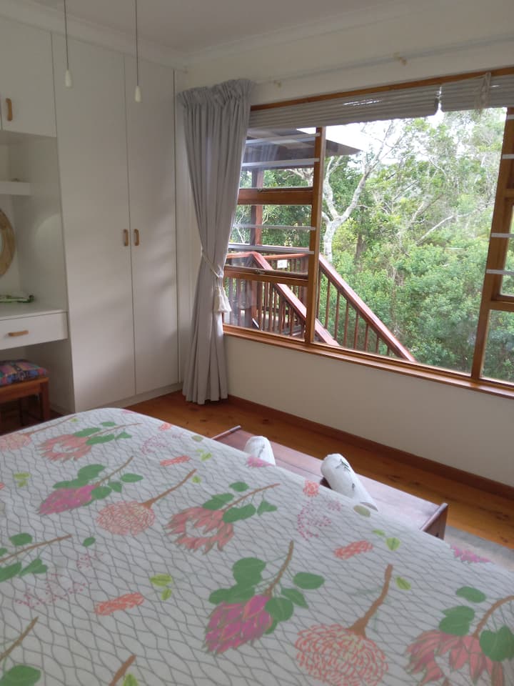 View from main bedroom built in cupboard and dresser.