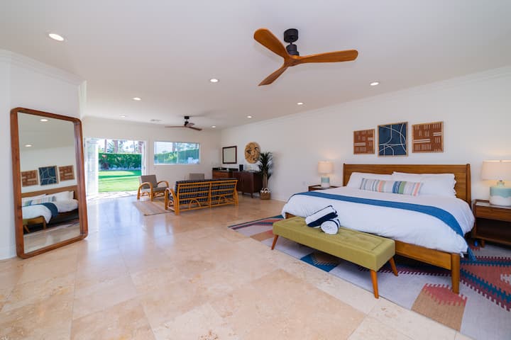 Large primary bedroom with access to the backyard