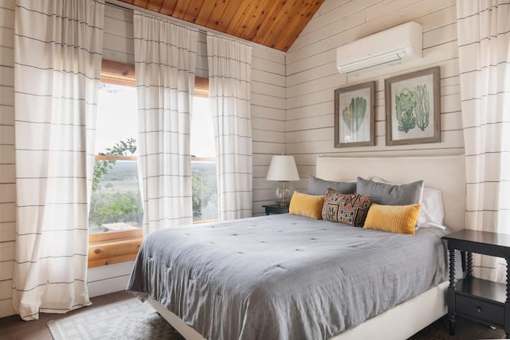 Sumptuous queen bed for evening slumber made complete with a beautiful view.