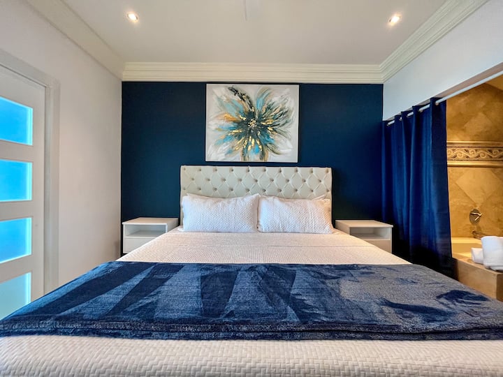 Discover the epitome of comfort in the master bedroom, featuring a lavish king-size bed that promises a night of sheer luxury.