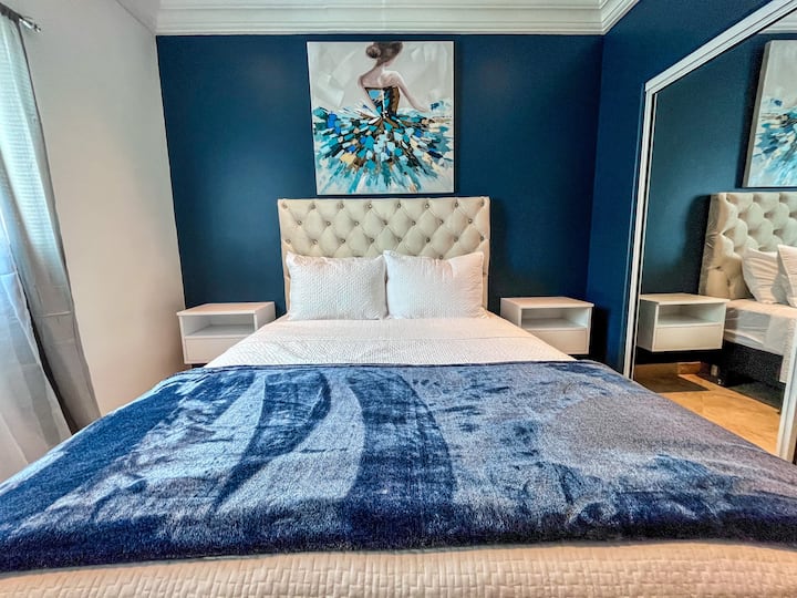 Discover the epitome of comfort in the guest bedroom, featuring a lavish queen-size bed that promises a night of sheer luxury