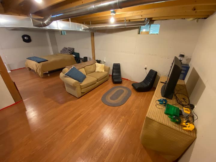 The basement was newly upgraded in October 2020.  The recreation area features an older TV with a Roku as well as a vintage N64.