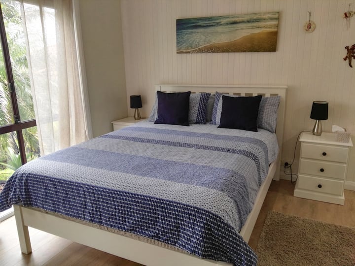 Comfortable new queen bed and side tables