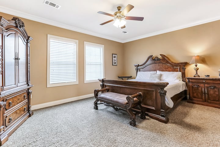 Main Home- King Bedroom features private bathroom with deep soaking tub and standup shower.
