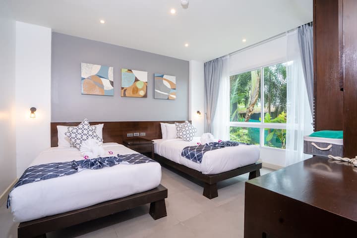 Dormitorio de invitados con camas individuales