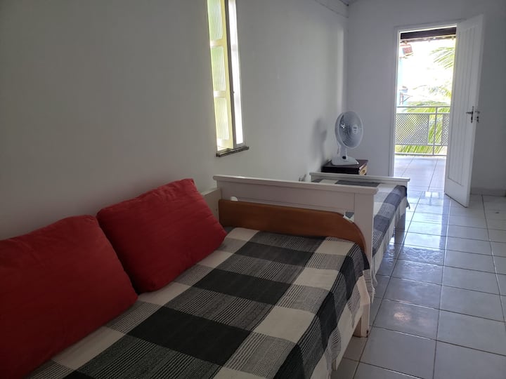 Small upper suite with 2 single beds and exit to the balcony.