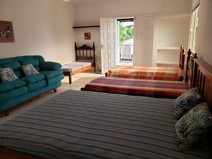 Top large suite. 1 double bed, 3 single beds, 1 sofa bed and exit to the balcony with sea view