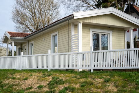 Cozy wooden house with private entrance and small garden