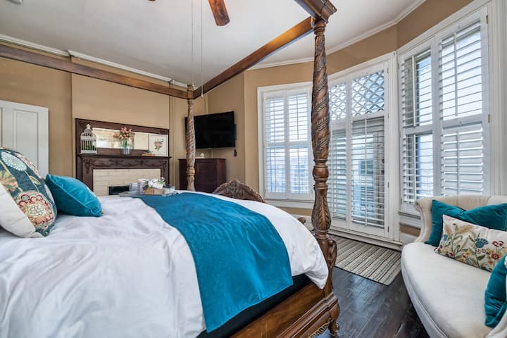 Master bedroom with comfortable king size bed and TV on the second floor. 