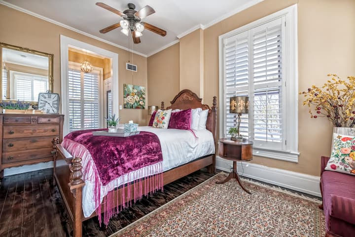 The maroon room. Comfortable queen size bedroom on the second floor with TV.