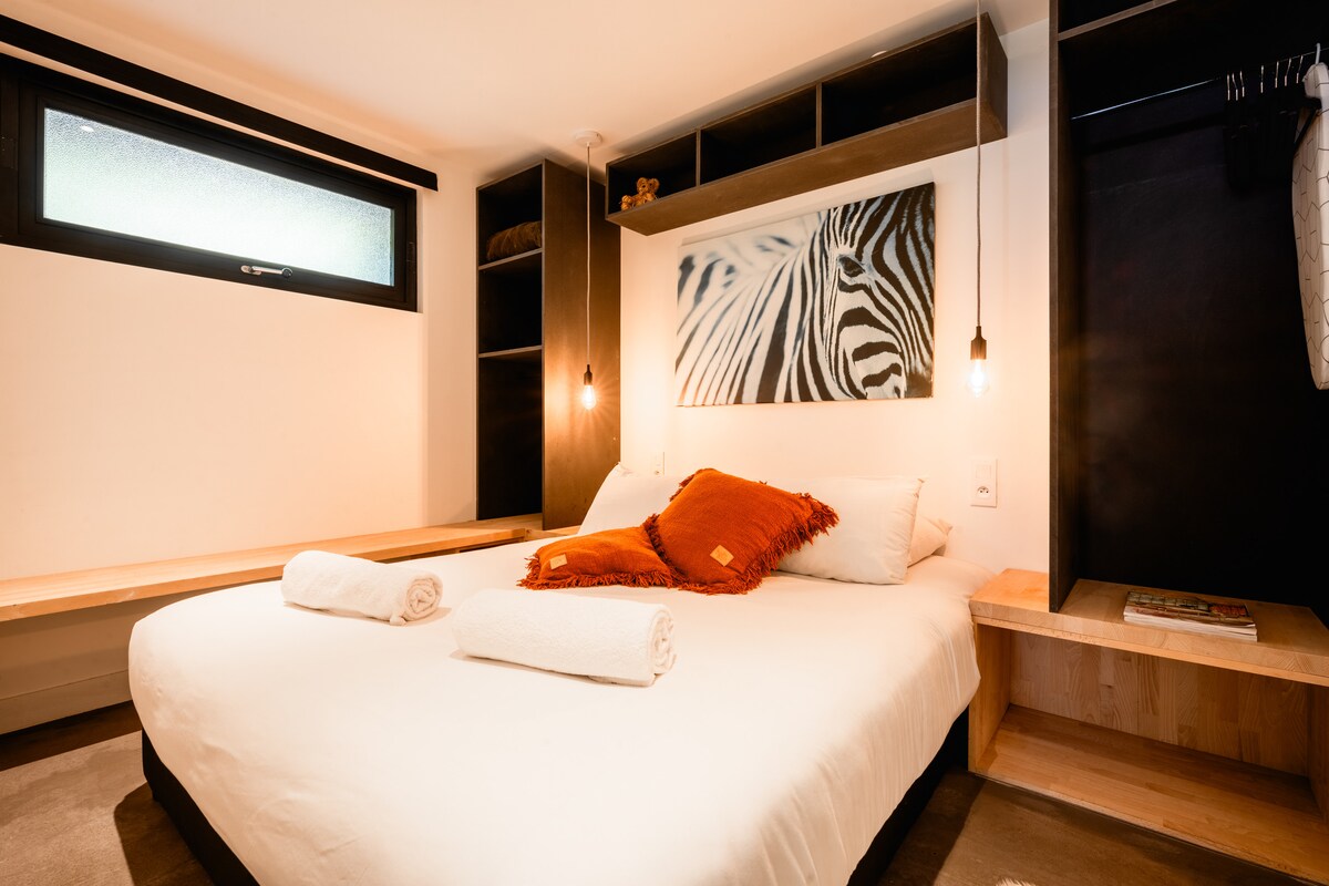 A very cosy room with storage, a mirror and a wardrobe area (you will also find a small ironing board and an iron if needed)