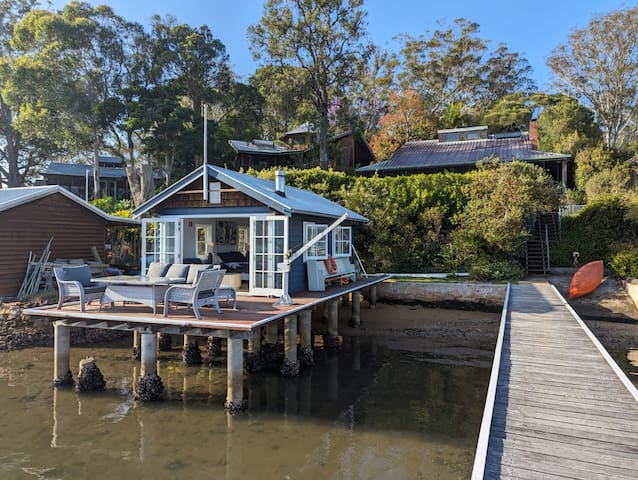 Absolute water-front island home and boat house