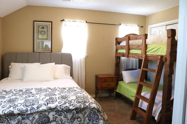 Upstairs Bedroom #2:  queen bed with bunkbeds and view of front lawn 

full bath down the hall