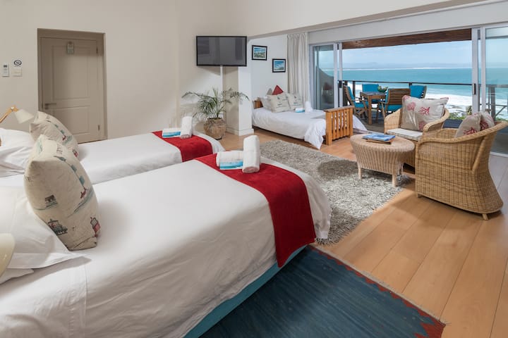 Looking out of Room 15 at African Perfection 2, with the beds set-up for 3 adults two share. Two singles and the sleeper couch.