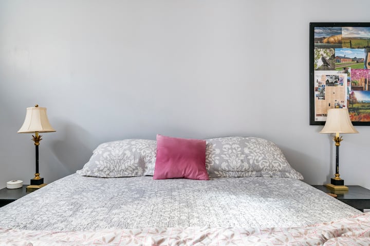 Master bedroom with king bed and en suite bathroom. 
