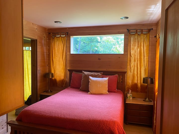 Downstairs bedroom. Doorway on the left leads through the laundry room to the bathroom.