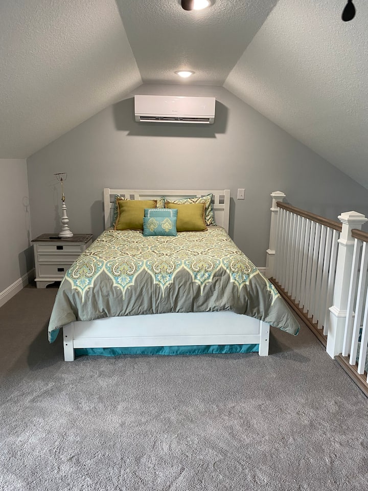 Queen size bed in loft. Bed has gel memory foam for a great night's sleep. This loft also has a king size trundle bed w/memory foam mattress. When not used as a king size bed it makes for the perfect sitting room. Please note it is all open concept. 