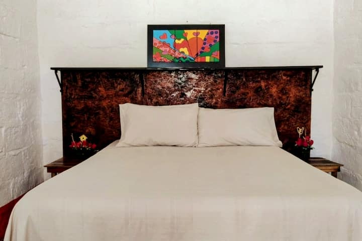 Queen bedroom with en-suite bathroom and fresh white linens