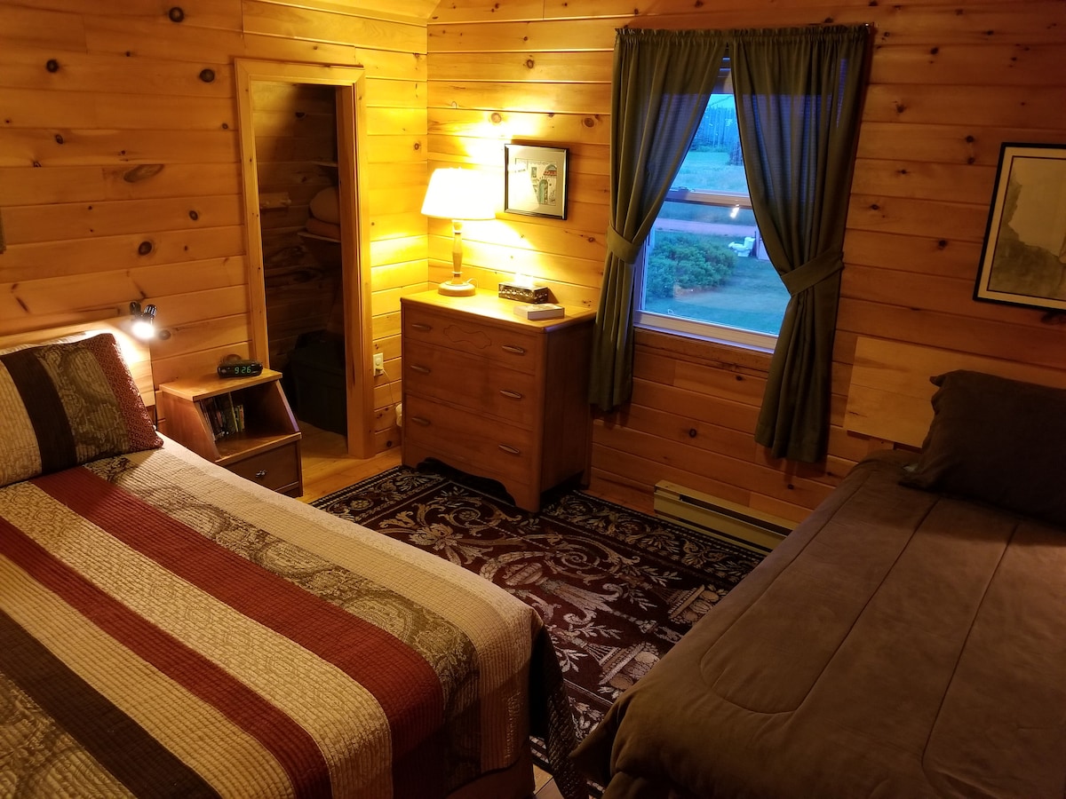 The second bedroom has a new queen mattress and a cozy single bed. There are even books for all ages in the nightstands!