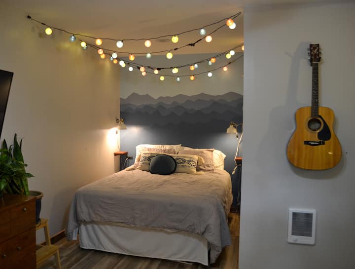 New mural & lights over the bed!

Queen memory foam mattress.  Feel free to swivel the TV to watch from bed.