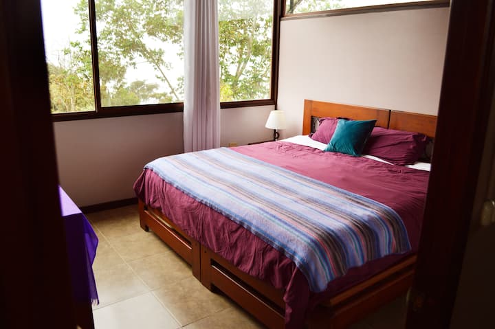 Upstairs King bed with private bath garden and valley views.