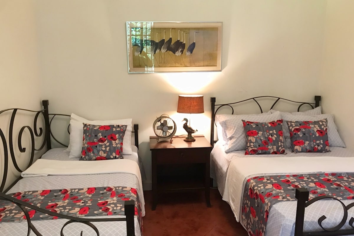 2nd bedroom on the lower floor. One double bed, one single bed.