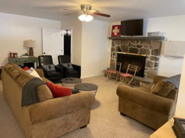 Come relax in the living room with recliners, a queen pull out sofa & brand new smart tv. 

*Fireplace is decorative only*
