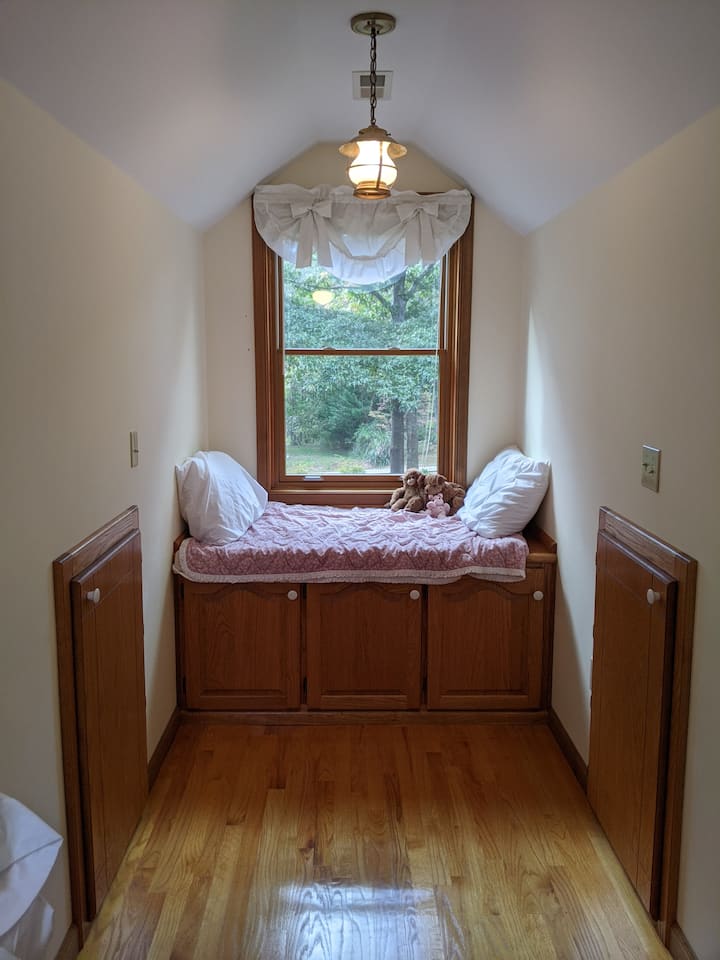 Both second floor bedrooms have a window seat with storage underneath.