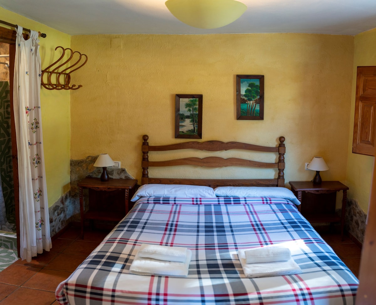 The bedroom of the Cortijillo bungalow:  One bedroom with a double bed and private bathroom.