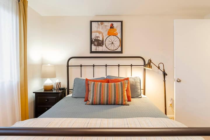 The downstairs "Firelight Bedroom" offers a more masculine aesthetic and includes an electric fireplace to welcome you on a chilly day.