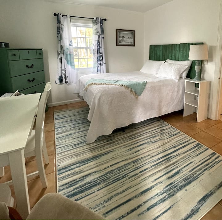 This large light and bright, queen bedroom, has a desk to work quietly.  