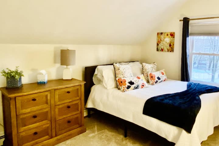 Queen-sized bed with bureau, and closet space. 