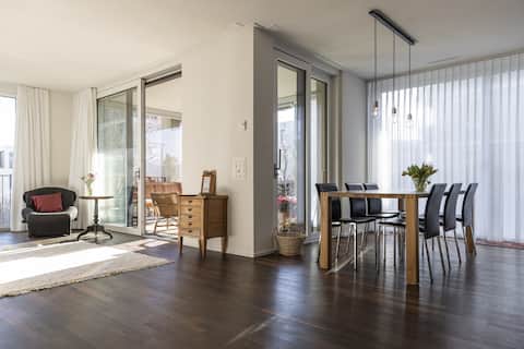 Bright, modern apartment with garden seating