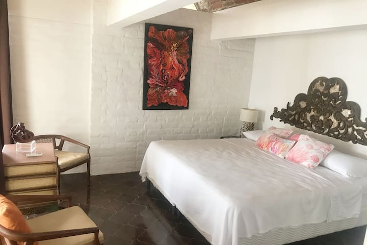 Room 2: King bed · Ocean view · Private and serene — perfect for couples.