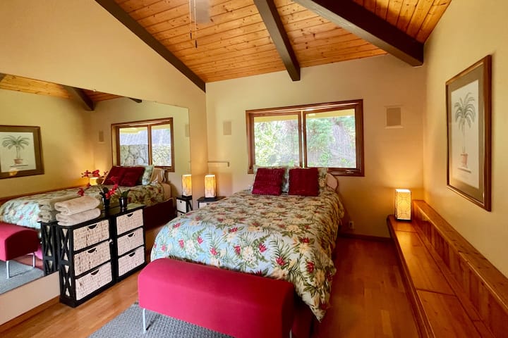Attached to the main house with its own private entrance, this room is full of Aloha! Complete with a queen size bed, it opens up to the backyard through French doors, and boasts its own small patio great to sip on Kona Coffee to greet the new day.