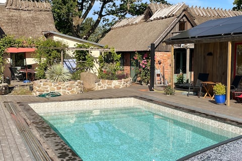 Successful Airbnb property: Unique accommodation under a thatched roof, pool and playground in Simrishamn