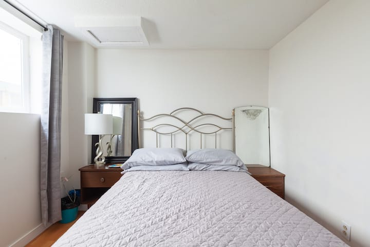 2nd bedroom with double bed.  Crow picture because East Van is known for its crows 