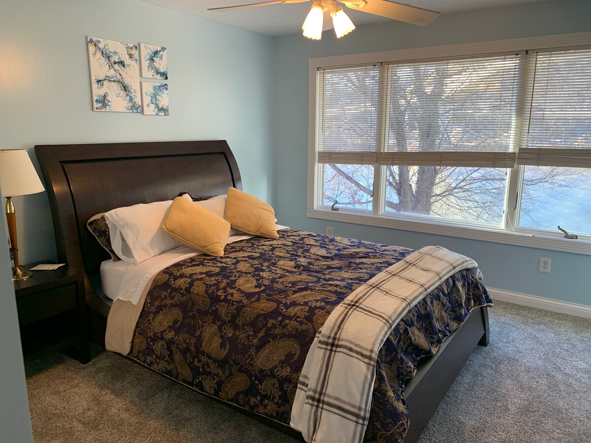 3rd bedroom with queen sized bed and river view.