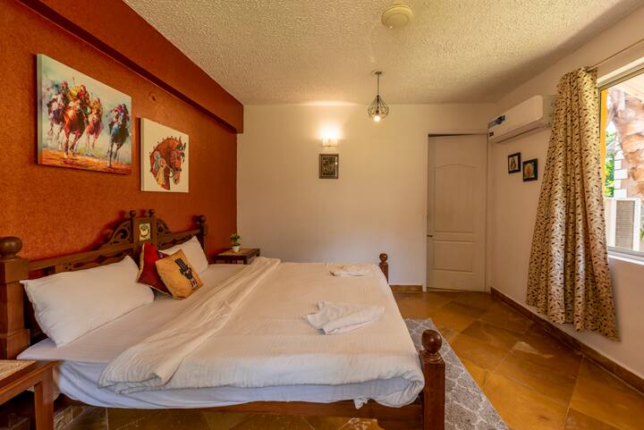 The bedroom is adorned with soft, plush pillows and a cozy, inviting comforter that beckons you to sink into its embrace. The walls are painted in soothing, warm tones, creating a serene ambiance that instantly puts your mind at ease.