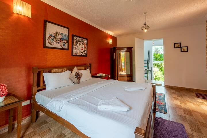 The bedroom is adorned with soft, plush pillows and a cozy, inviting comforter that beckons you to sink into its embrace. The walls are painted in soothing, warm tones, creating a serene ambiance that instantly puts your mind at ease.