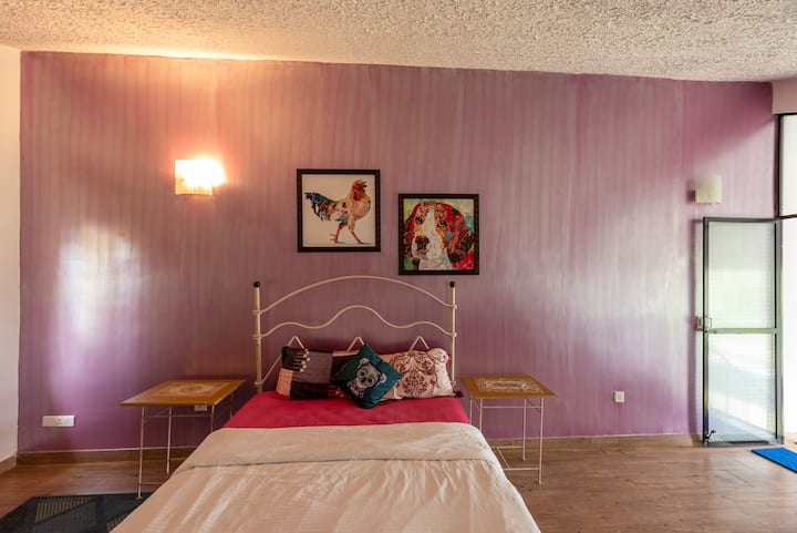 The attic bedroom is a true gem, with its whimsical decor and charming ambiance. The restored furniture adds a touch of nostalgia, while the cozy brass bed invites guests to unwind and indulge in a peaceful night's sleep.