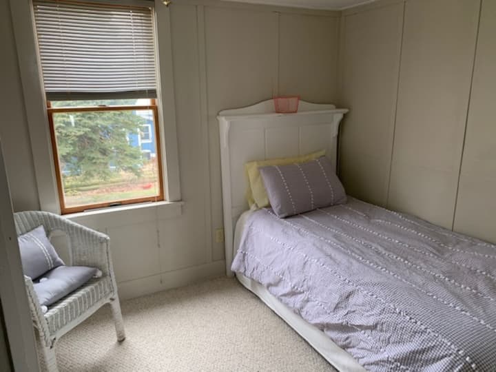 Smallest bedroom, but charming “Aunt Karen’s Room.” Comfortable and quiet on the south west corner.