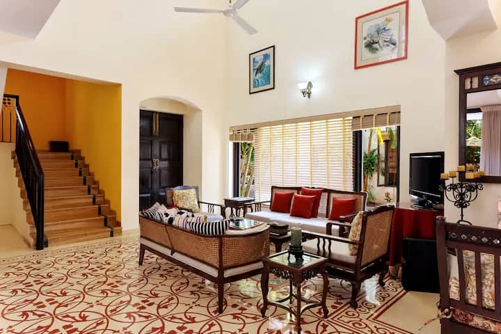 The living area is right next to the staircase that leads to the two bedrooms upstairs including the master bedroom