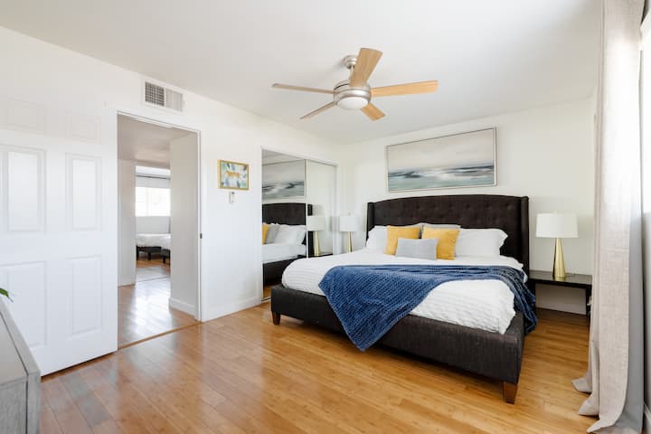 Bedroom #1 has a king bed and sliding closet door to the left. 