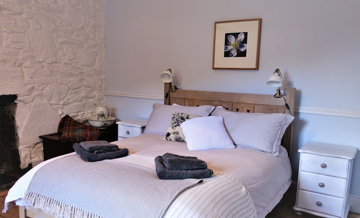 Bedroom 1. A large double bedroom with craftsman-made double bed. 