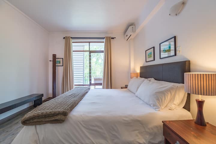 The apartment has one bedroom, which features an extra-length king size bed.