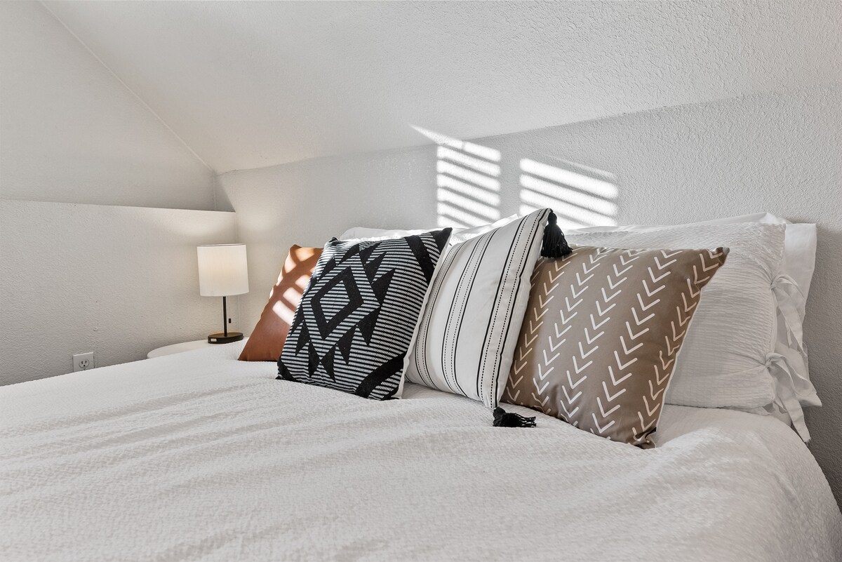 The queen-sized bed comfortably sleeps one or two and the blinds on the window can be kept open or closed. 