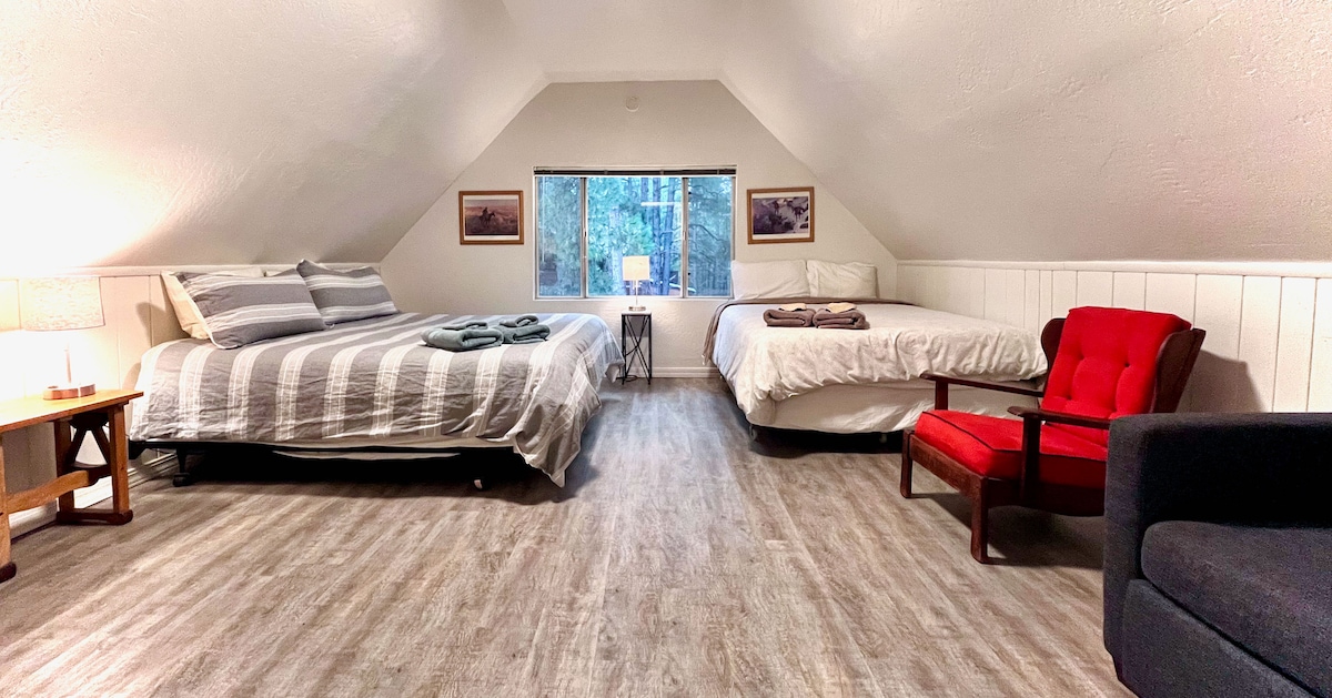 Second room upstairs with multiple beds, king, queen and sleeper sofa. 